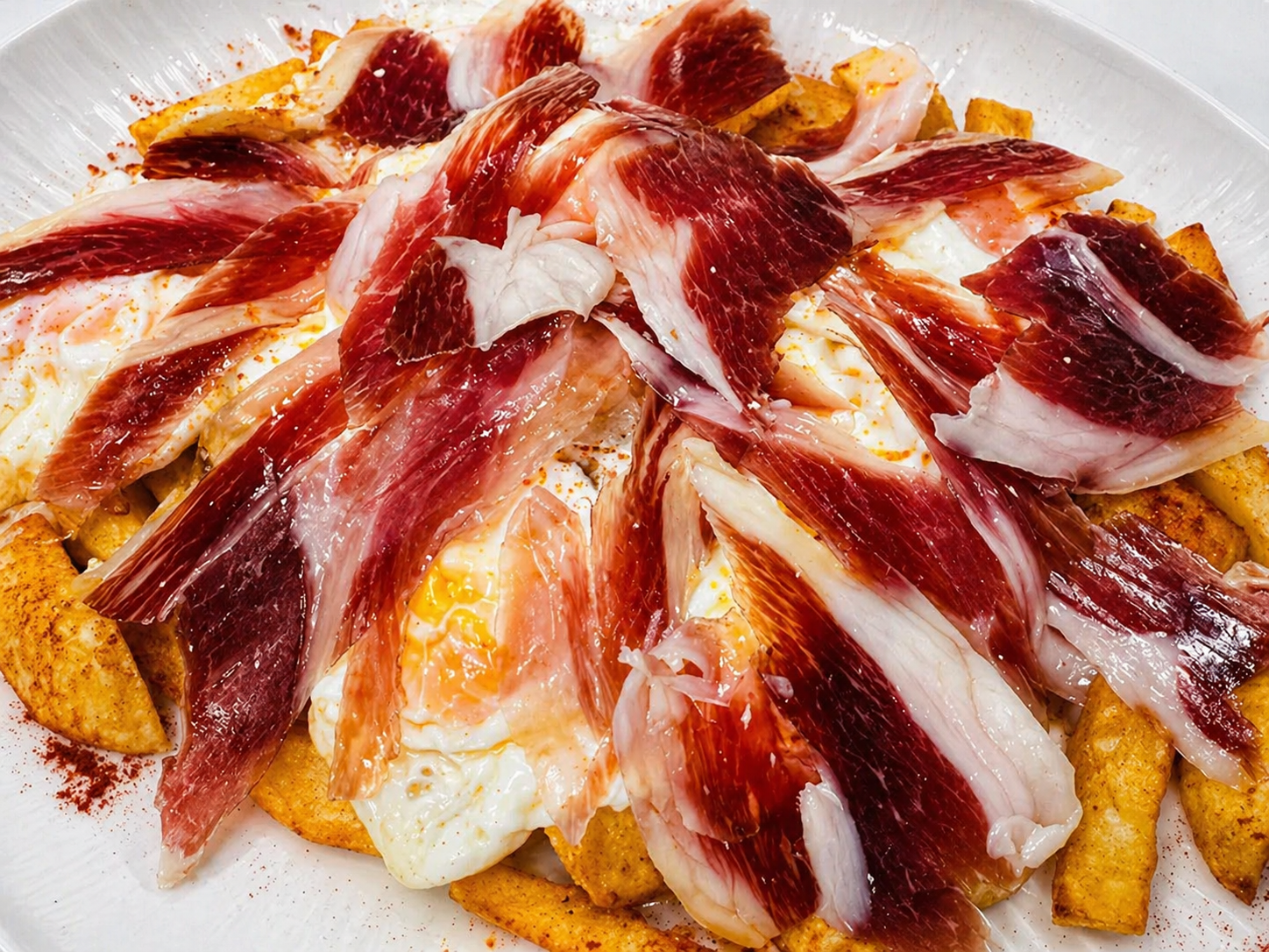 Huevos rotos con jamón en El Rincón del Norte, Valdemoro